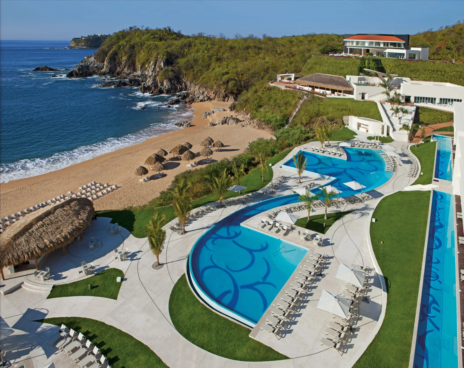 Secrets Huatulco adults-only all-inclusive beachfront resort with secluded bay setting and romantic pools